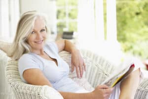 Older Woman Sitting On Chair