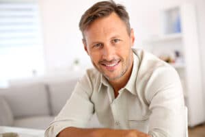 smiling man relaxing at home-img-blog